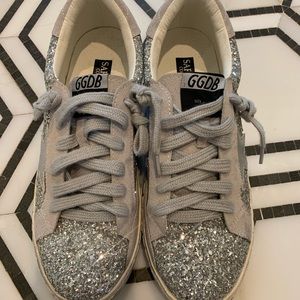 Silver glitter star sneakers with distressed soles